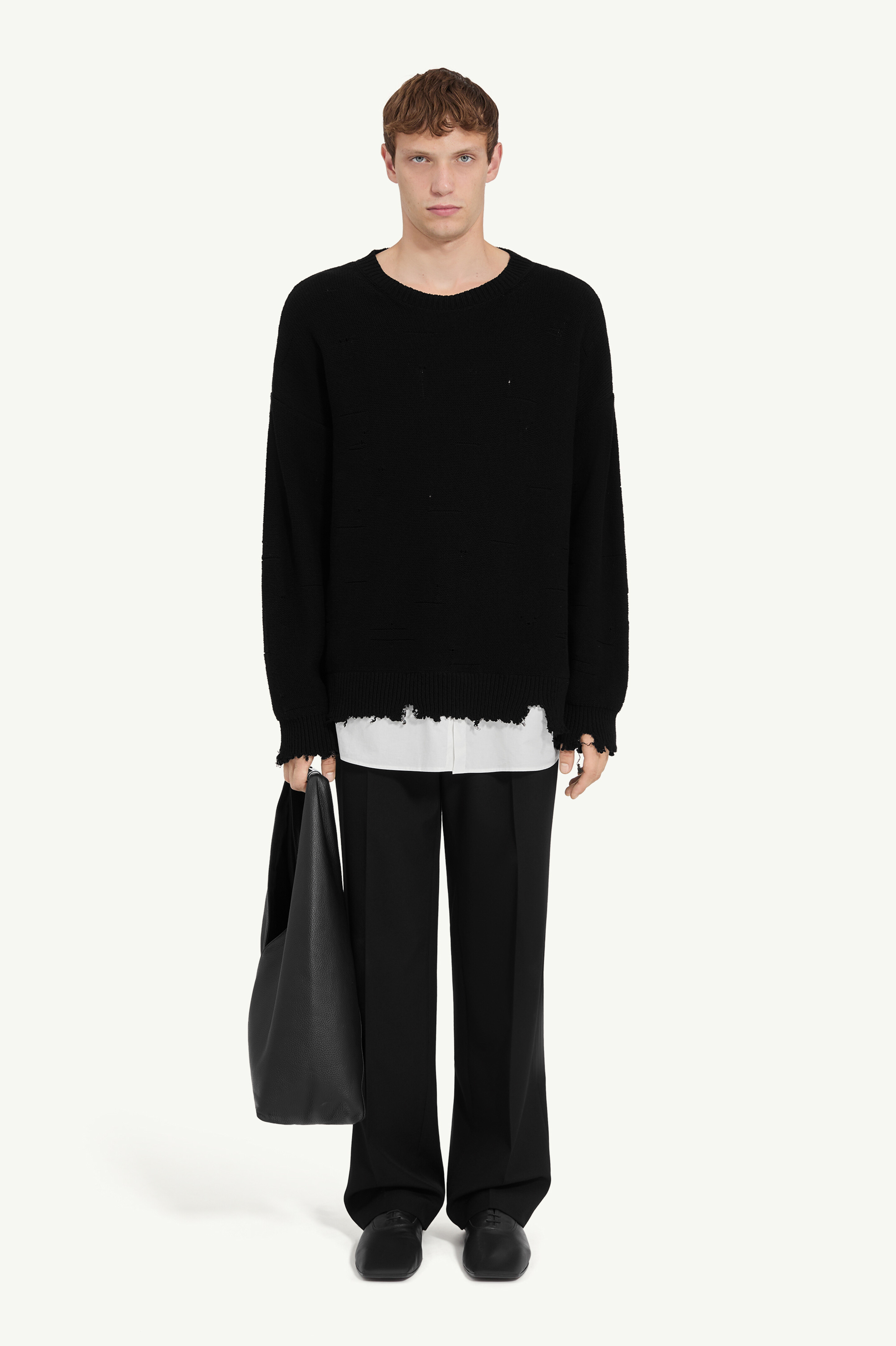 Distressed hem sweater